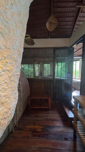 Ein Sitzbereich in der Unterkunft Bambu Huts