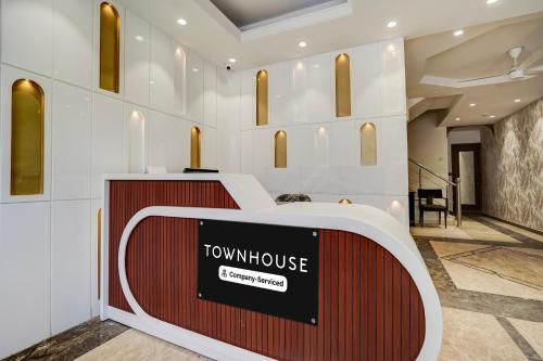 a view of a town house lobby with a sign at Super Townhouse Karol Bagh Formerly Hotel Unistar in New Delhi