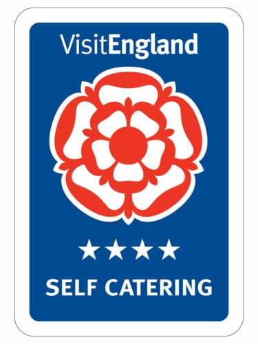 a sign for vietlez island self catering sticker at Customs Cottage in Teignmouth