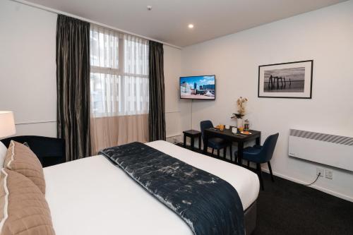 Katil atau katil-katil dalam bilik di Gilmer Apartment Hotel