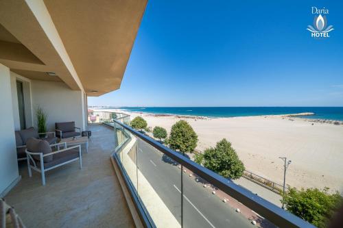 a balcony with a view of the beach at Daria Boutique Hotel in Eforie Sud