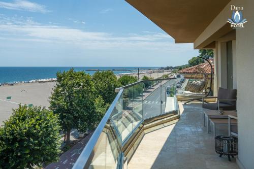 a balcony with a view of the beach at Daria Boutique Hotel in Eforie Sud