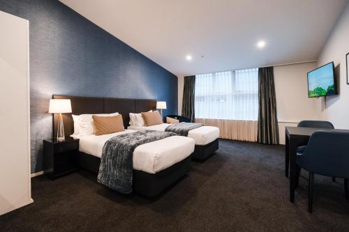 Katil atau katil-katil dalam bilik di Gilmer Apartment Hotel