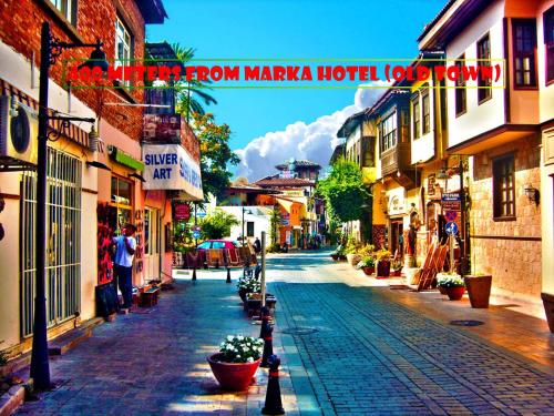 an empty street in a town with buildings at Marka Hotel in Antalya
