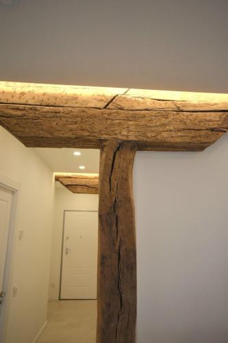 a wooden beam on top of a wall at Sotileza Select Santander in Santander