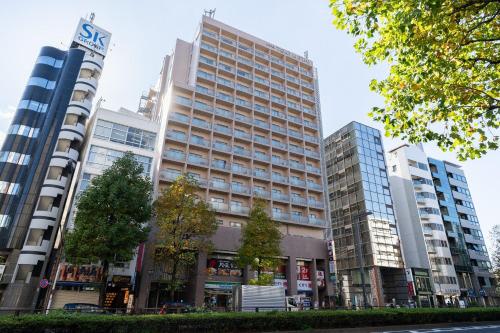 a group of tall buildings in a city at Tokyu Stay Yotsuya in Tokyo