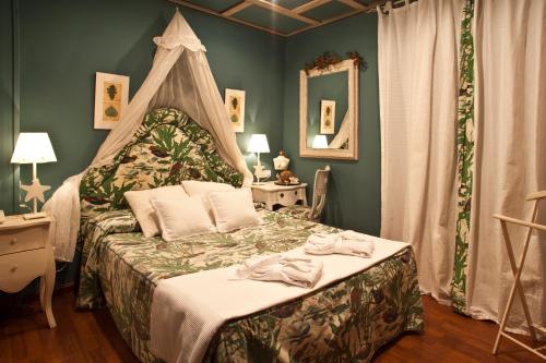Säng eller sängar i ett rum på Hotel El Ciervo