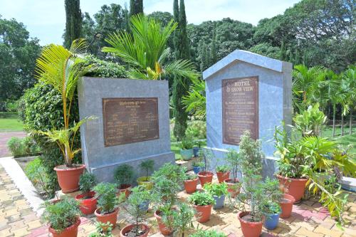 a display of potted plants in a garden at Hotel Snow View in Daringbadi