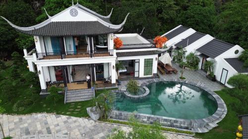an aerial view of a house with a swimming pool at Happy Tam Coc Ecolodge in Ninh Binh