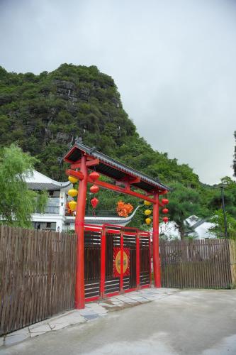 a red structure in front of a fence at Happy Tam Coc Ecolodge in Ninh Binh