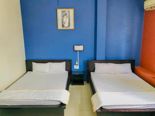 Кровать или кровати в номере Thien Huong Hotel