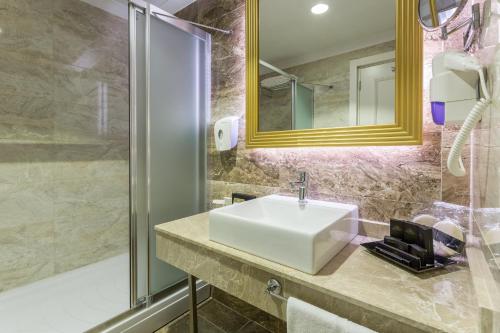a bathroom with a sink and a shower at Mary Hotel Side in Side