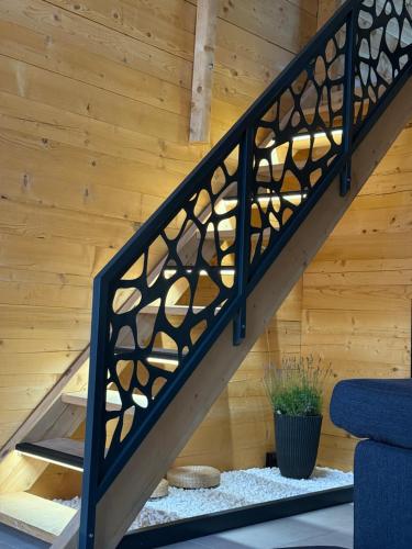 a staircase in a house with wooden walls at Casa del Corniolo in Čortanovci