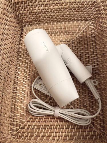 a white wii remote on a wicker basket at OPEN! TOKYO Kitasenju A Newly built stylish room! in Tokyo