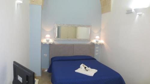 Ένα ή περισσότερα κρεβάτια σε δωμάτιο στο Antico Casale B&B