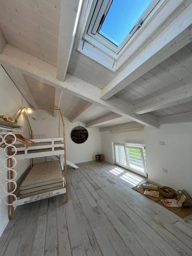 a room with a loft bed and a skylight at SlowCasa in Torrevecchia Teatina
