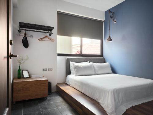 Una cama o camas en una habitación de 未艾公寓WeLove Apartment