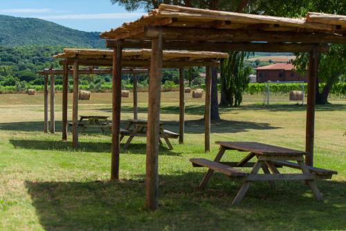 a picnic table and a pavilion in a park at Tenuta Agricola dell'Uccellina in Talamone