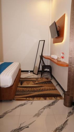 Ένα ή περισσότερα κρεβάτια σε δωμάτιο στο Jazz Room Kampung Inggris Syariah
