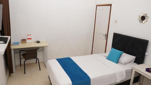 Ένα ή περισσότερα κρεβάτια σε δωμάτιο στο Jazz Room Kampung Inggris Syariah