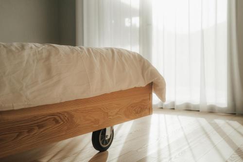 a bed with a blanket on it in a room at Chalet Herol in Luson