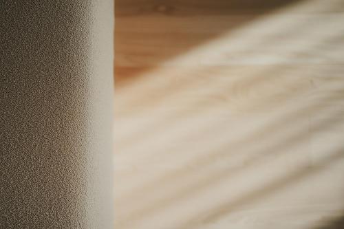 a close up of a white curtain next to a bed at Chalet Herol in Luson