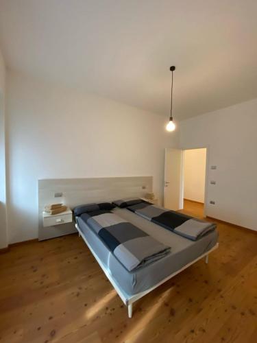 a bedroom with a large bed in a room at Balina apartment in Tenno
