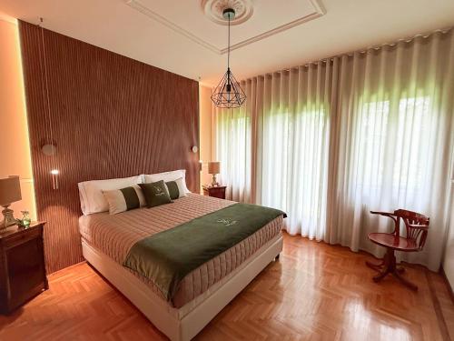 a bedroom with a bed and a pendant light at Villa Zane in Treviso