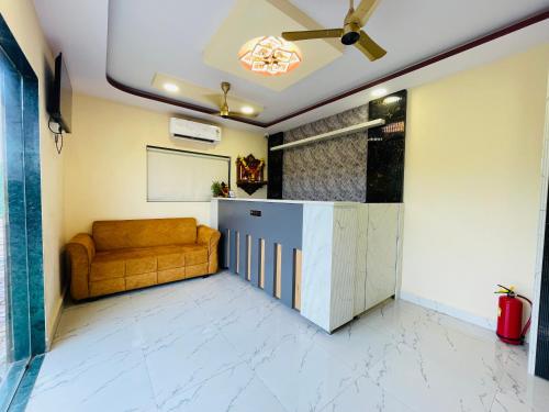 a living room with a couch and a table at Riverside Retreat Dombivli in Dombivli