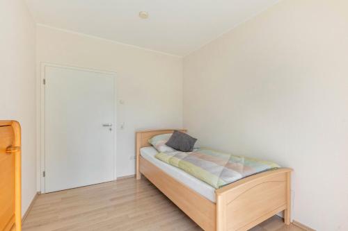 a small bedroom with a bed and a closet at Ferienwohnung Lahnurlaub in Huttenberg