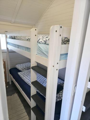 a couple of bunk beds in a room at Cozy Cabin in Čatež ob Savi