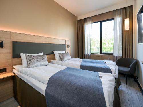 Katil atau katil-katil dalam bilik di Quality Hotel Strand Gjøvik