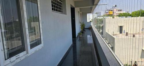 an empty balcony of a building with a view of a street at #101 Gokula Srigandha Fragrance in Shimoga