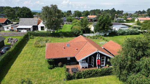 an aerial view of a house with an orange roof at Moderne sommerhus, 8 senge, 250 mtr til sandstrand in Slagelse