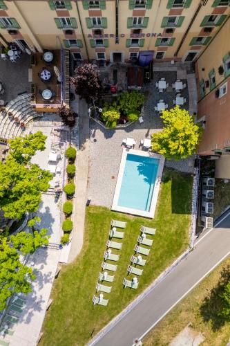 an overhead view of a courtyard with a swimming pool at Hotel Corona in Spiazzi Di Caprino