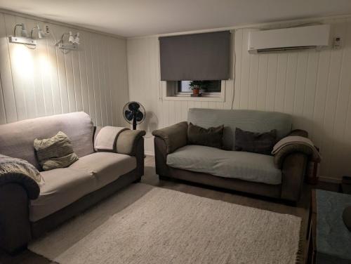 a living room with two couches and a couch at Close to Karmøy and Haugesund airport in Karmøy