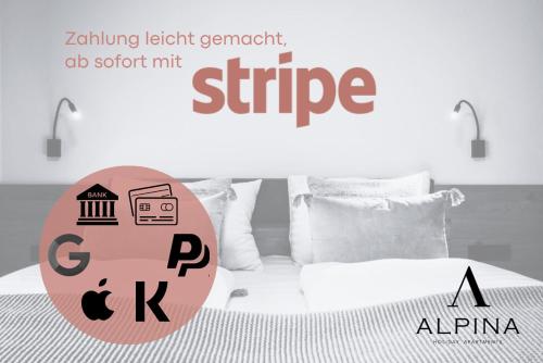 a bedroom with a white bed with a sign on it at Wagstätt Residenzen Jochberg by Alpina-Holiday in Jochberg