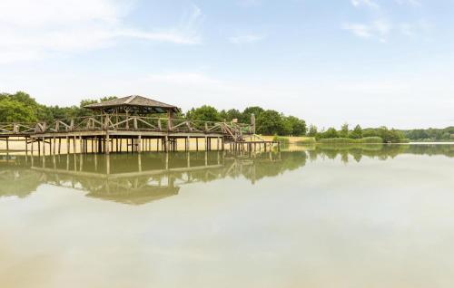 a wooden bridge over a lake with a gazebo at Nice Home In Erm With Wifi in Erm