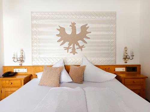 Uma cama ou camas num quarto em Hotel Möderle