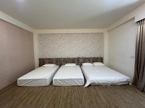 Ein Bett oder Betten in einem Zimmer der Unterkunft Matsu Star Yang Homestay