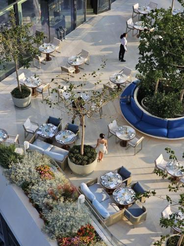 an overhead view of a courtyard with tables and chairs at Mercury Suite Designer Apartment with Pool Access in St Julian's