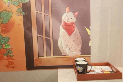 a painting of a cat sitting in a window at Na's Homestay Hải Phòng in Hai Phong