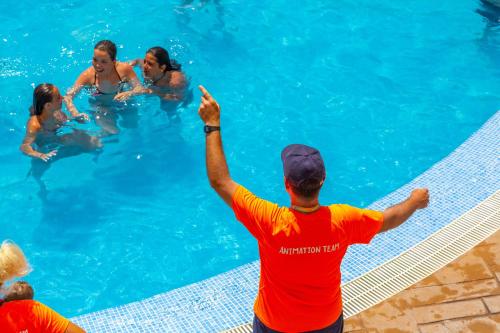 a group of people in a swimming pool at Gran Hotel Peñiscola in Peñíscola
