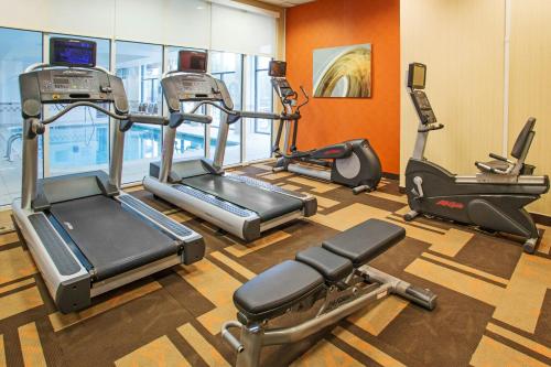 a gym with three exercise bikes in a room at Residence Inn Aberdeen at Ripken Stadium in Aberdeen
