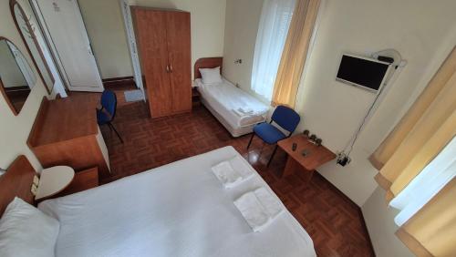 an overhead view of a bedroom with a bed and a television at Hotel Zenit Satovcha in Satovcha