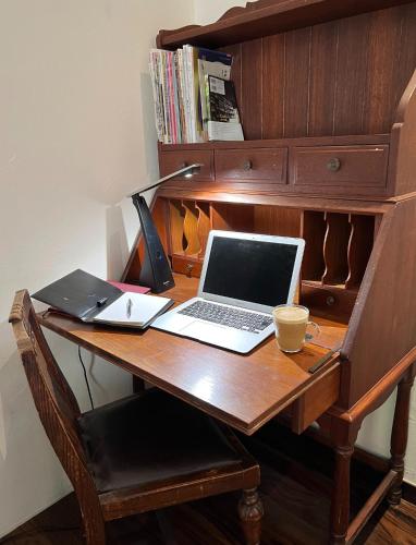 a desk with a laptop computer and a cup on it at Haramura - house / Vacation STAY 2211 in Hara