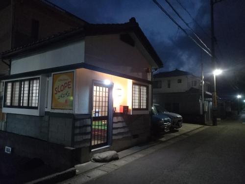 a small building with a soda shop at night at Bibi Vacation Rental Only 2 groups per day Vacation STAY 5768 in Sakai