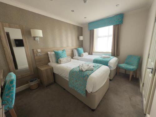 Una cama o camas en una habitación de Hotel Sheraton
