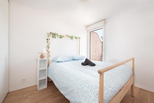 Postel nebo postele na pokoji v ubytování T2 balcon avec parking sécurisé et gratuit