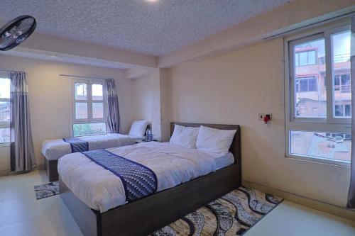 Giường trong phòng chung tại Hotel Kiba Nanee